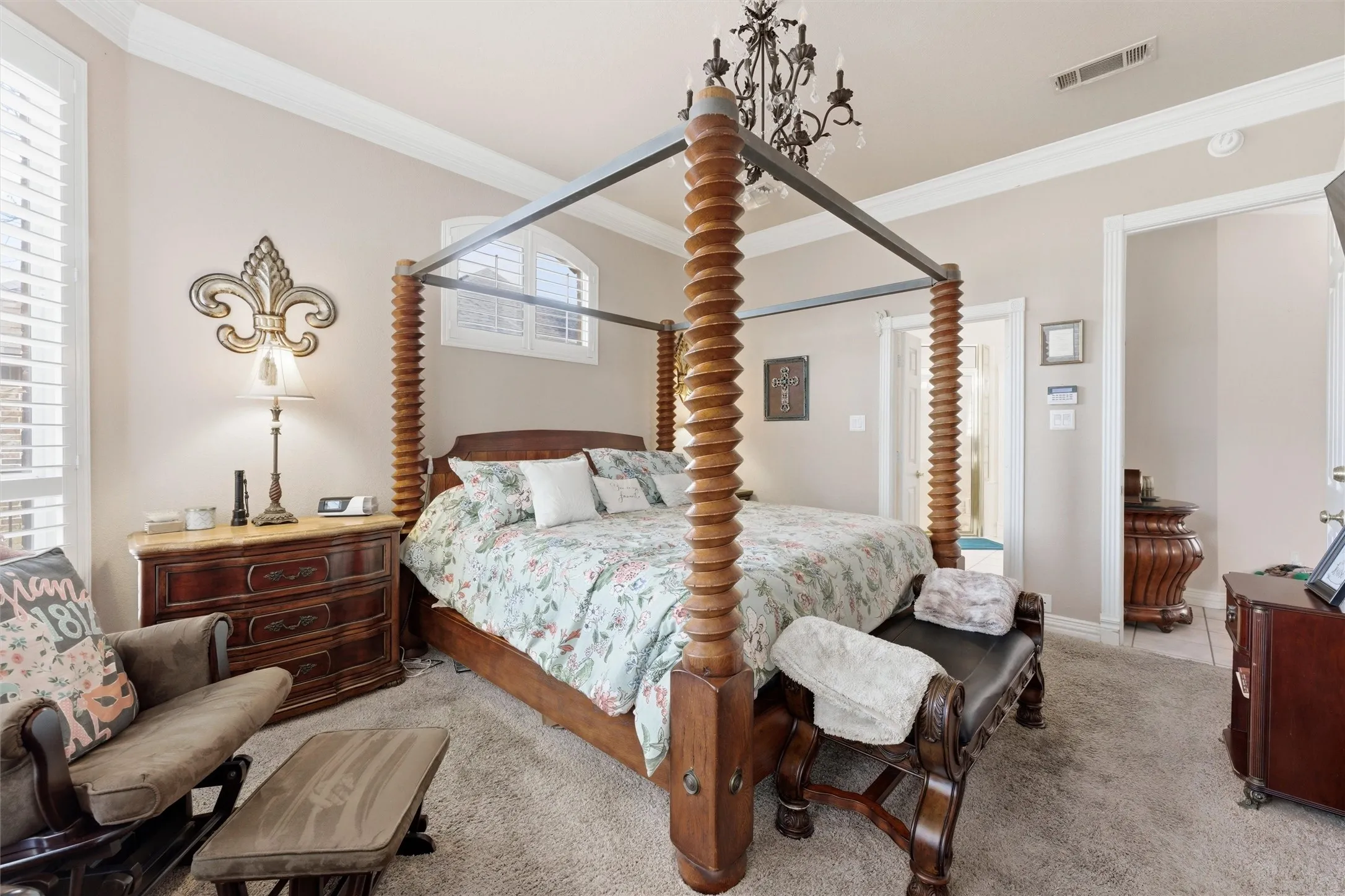 Bedroom featuring ornamental molding and light colored carpet