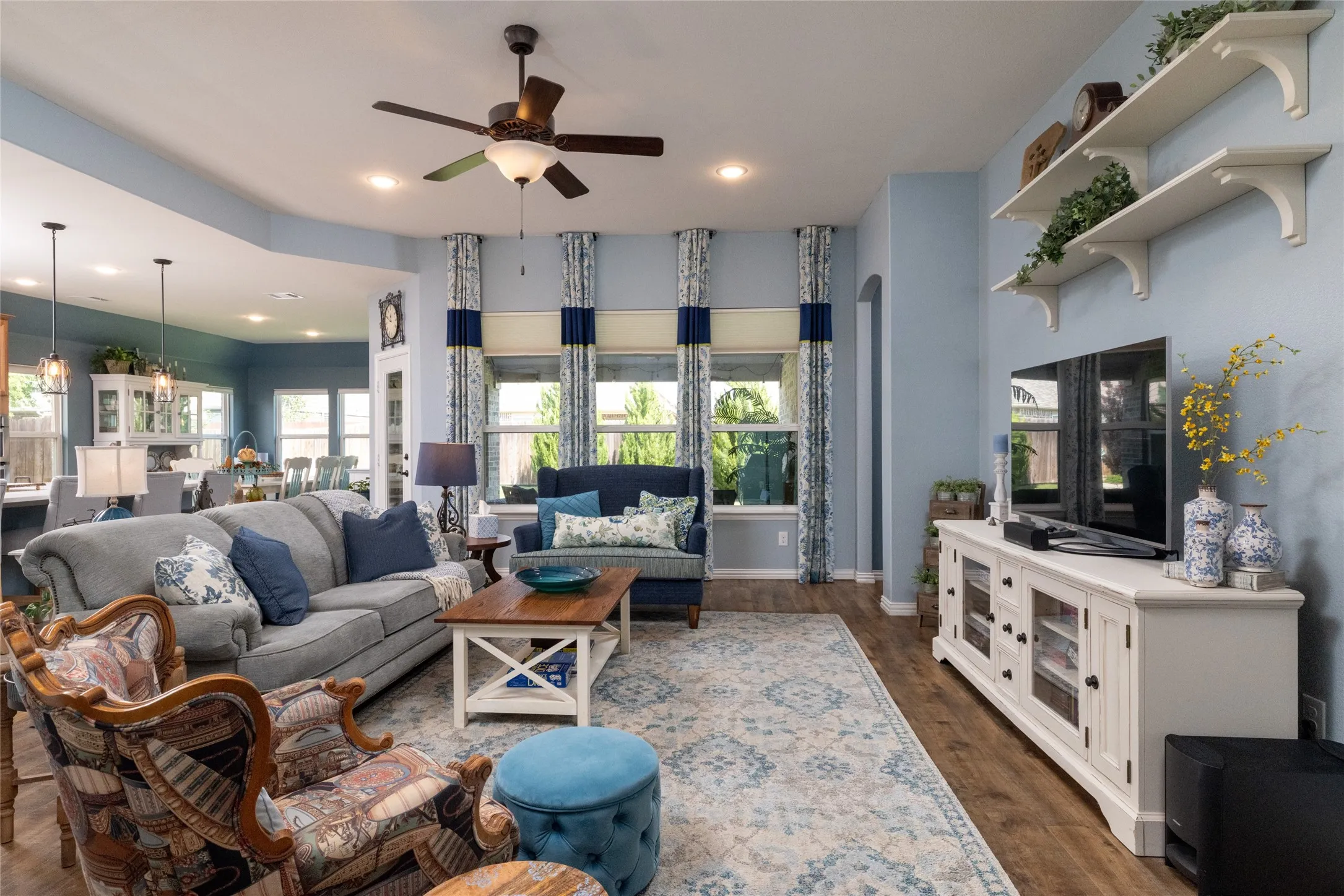 Spacious Open Concept - Main Living Area w Natural Lighting~Custom Drapery & Backyard Views...
