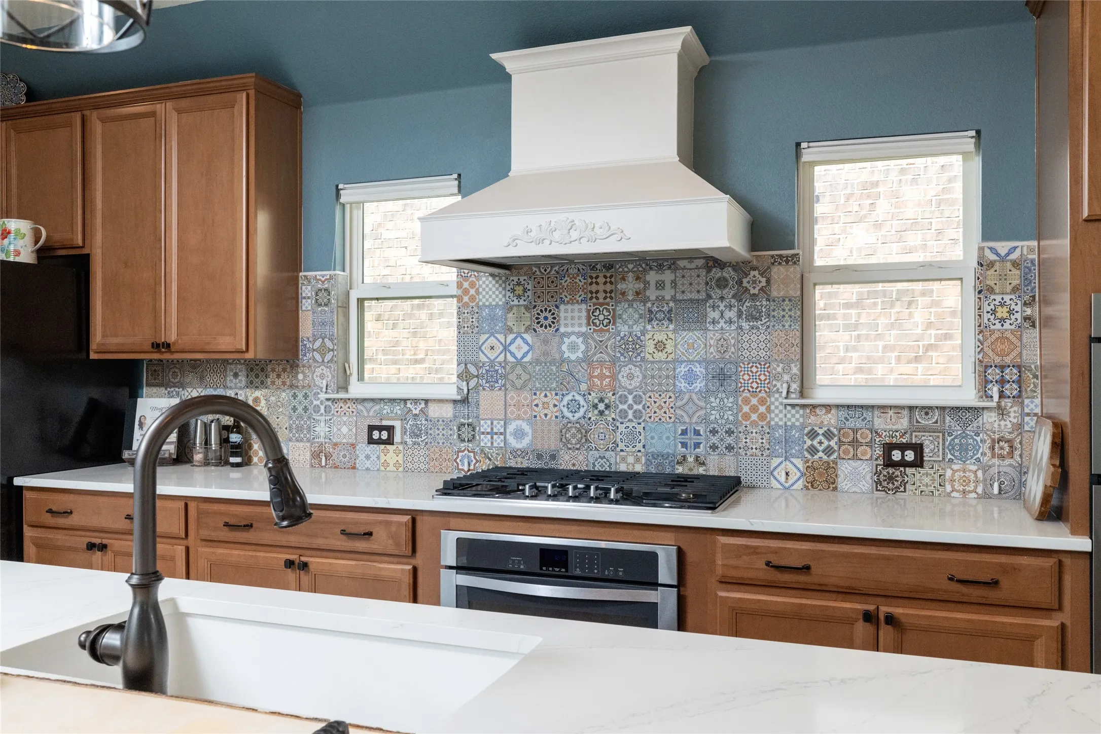 Custom Designed Backsplash & Vent Surround...