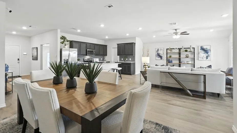 Dining room with light wood-style flooring, recessed lighting, and ceiling fan