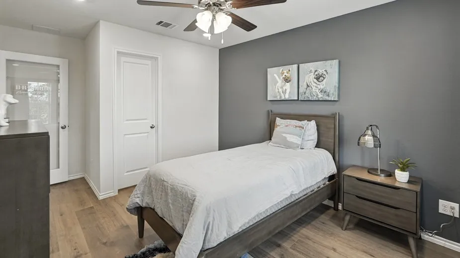 Bedroom featuring light wood finished floors and a ceiling fan