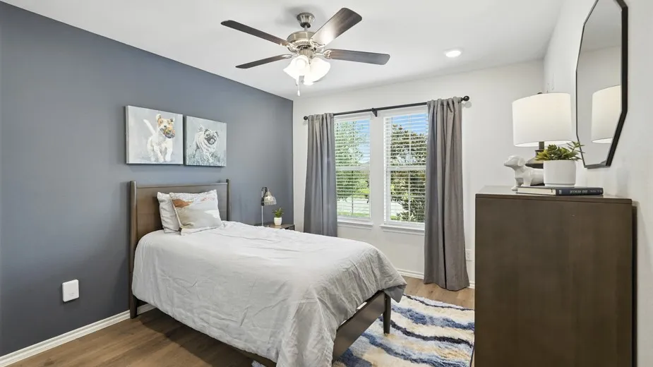 Bedroom with light wood-type flooring and ceiling fan