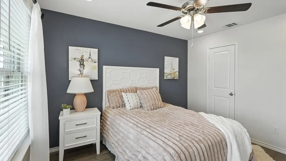 Bedroom with wood finished floors, a ceiling fan, and recessed lighting