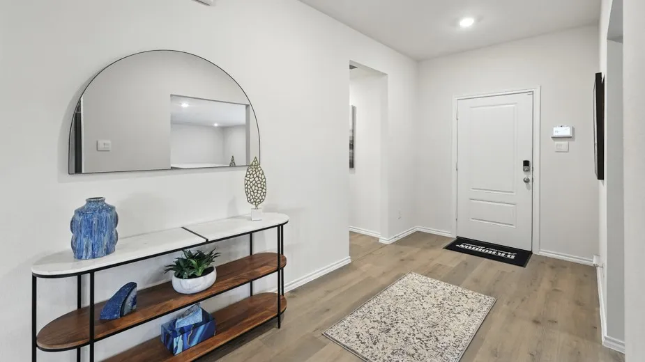 Entrance foyer featuring light wood finished floors and recessed lighting