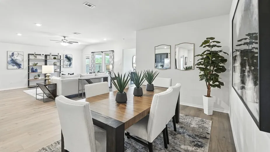 Dining area with wood finished floors, ceiling fan, and recessed lighting