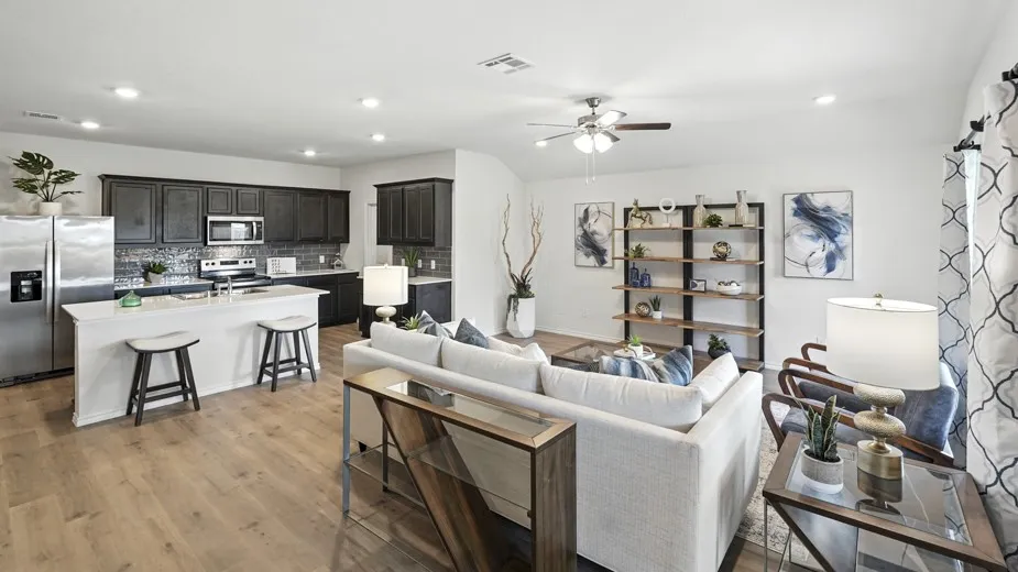 Living room featuring ceiling fan, recessed lighting, and light wood-type flooring