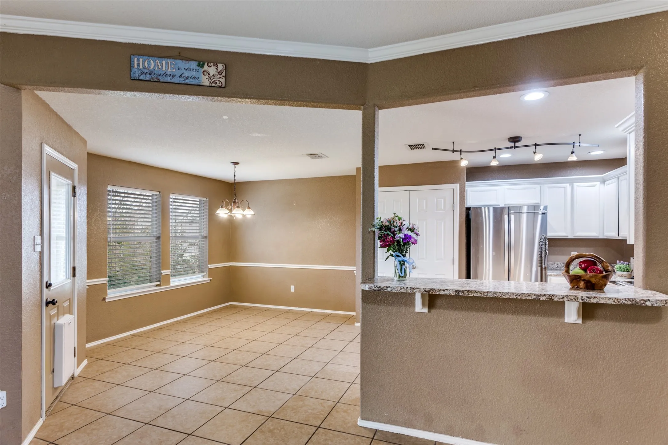 Easy flow from living area to kitchen and dining area.
