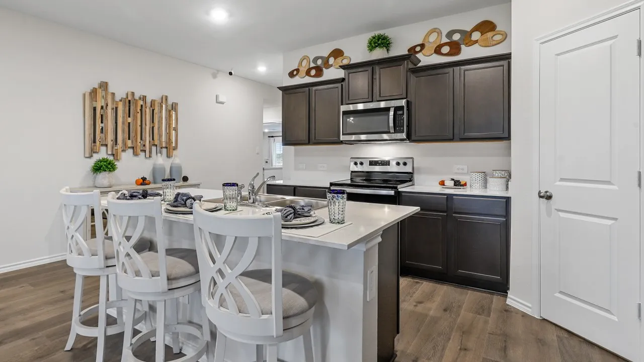 Modern kitchen featuring a central island with countertop seating