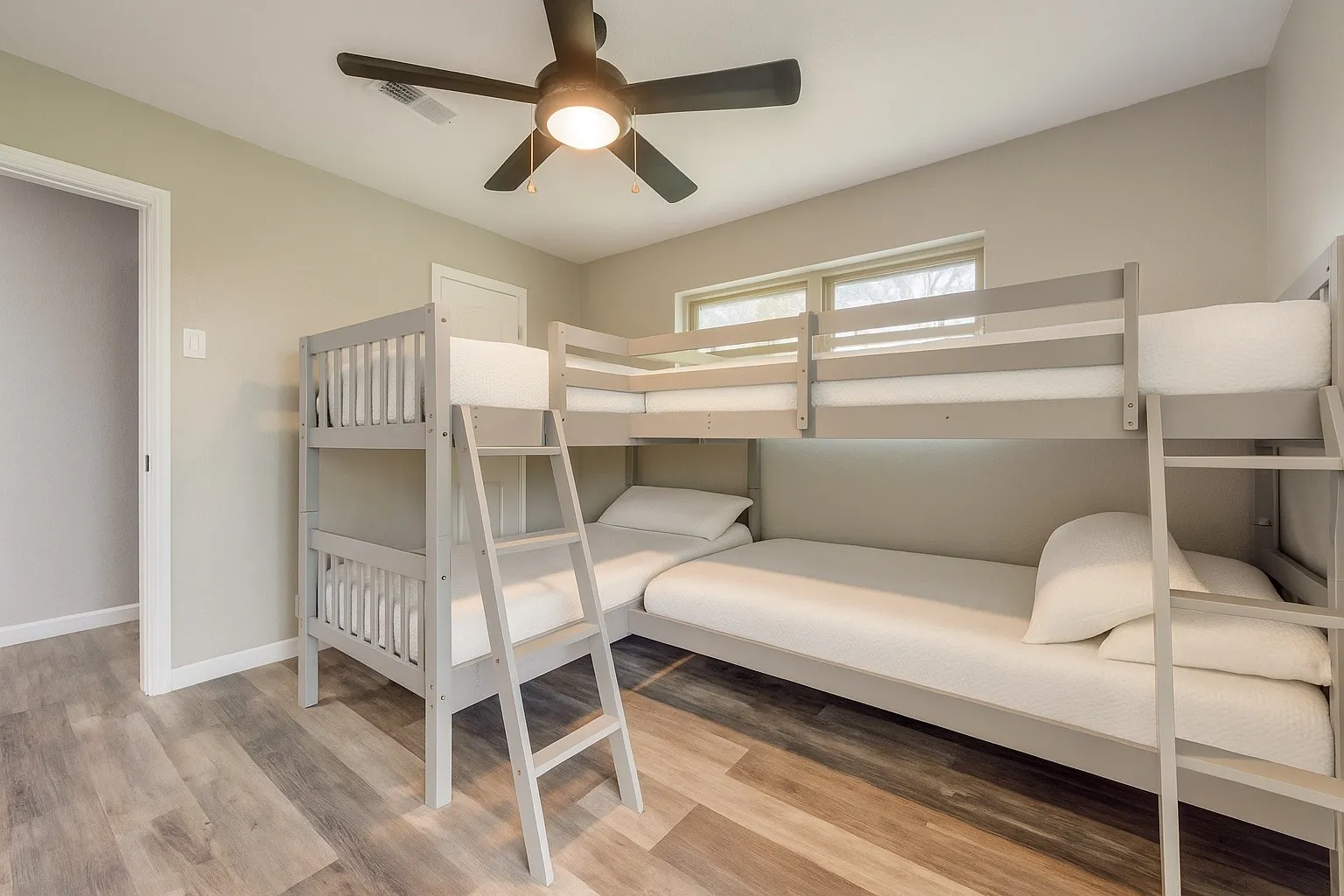 Bedroom with wood finished floors and ceiling fan