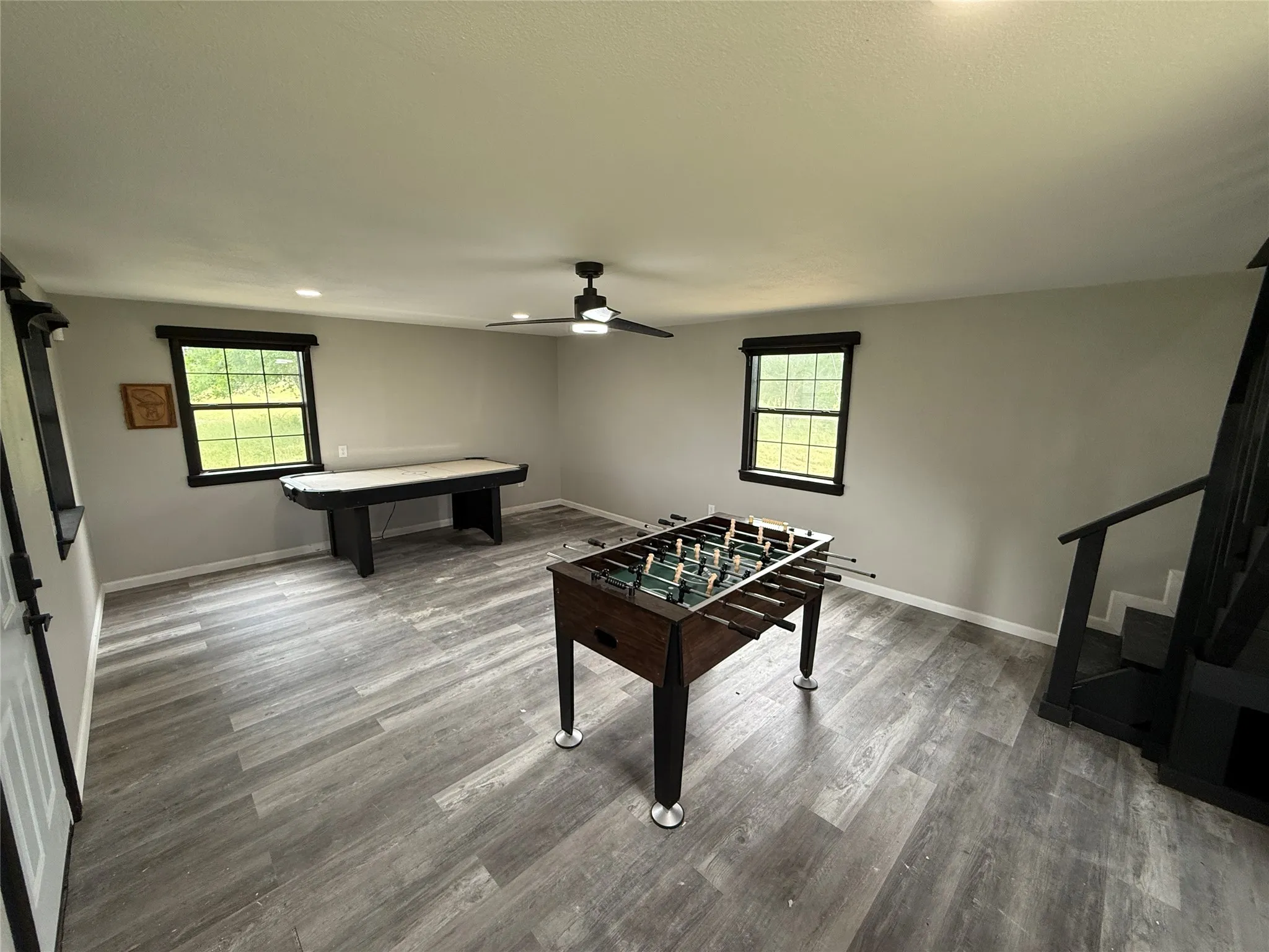 Recreation room featuring plenty of natural light, a ceiling fan, wood finished floors, pool table, and recessed lighting
