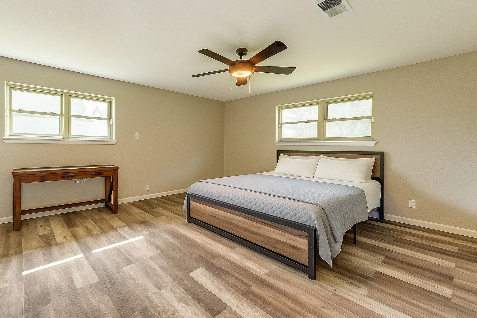 Bedroom featuring light wood finished floors and ceiling fan