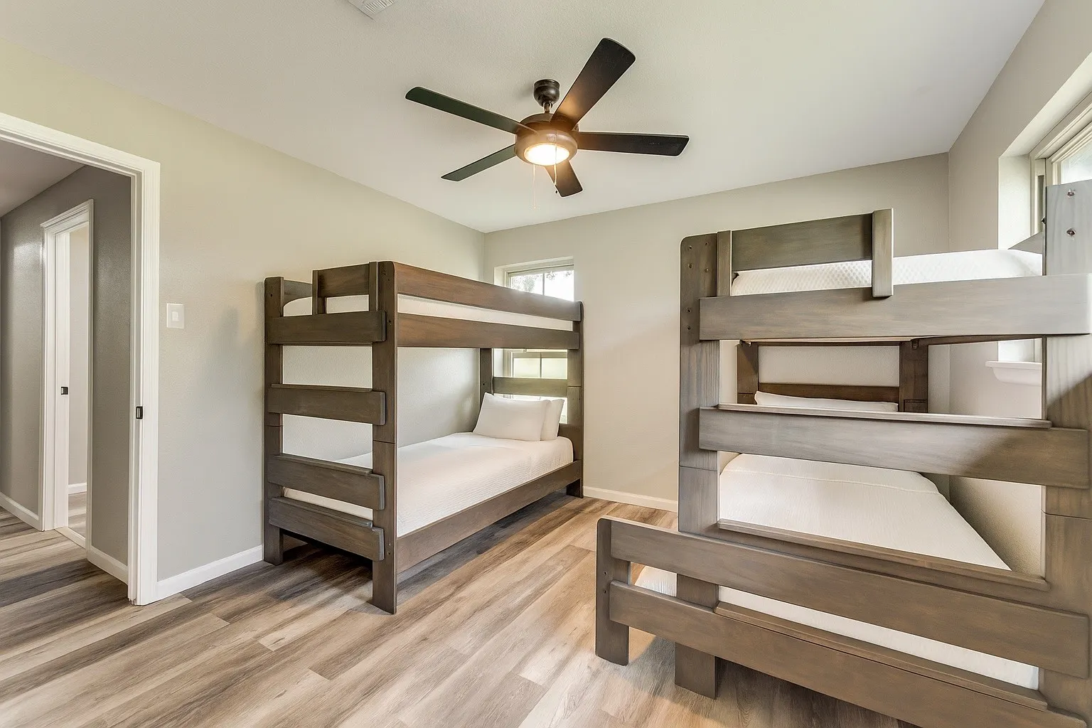 Bedroom with wood finished floors and ceiling fan