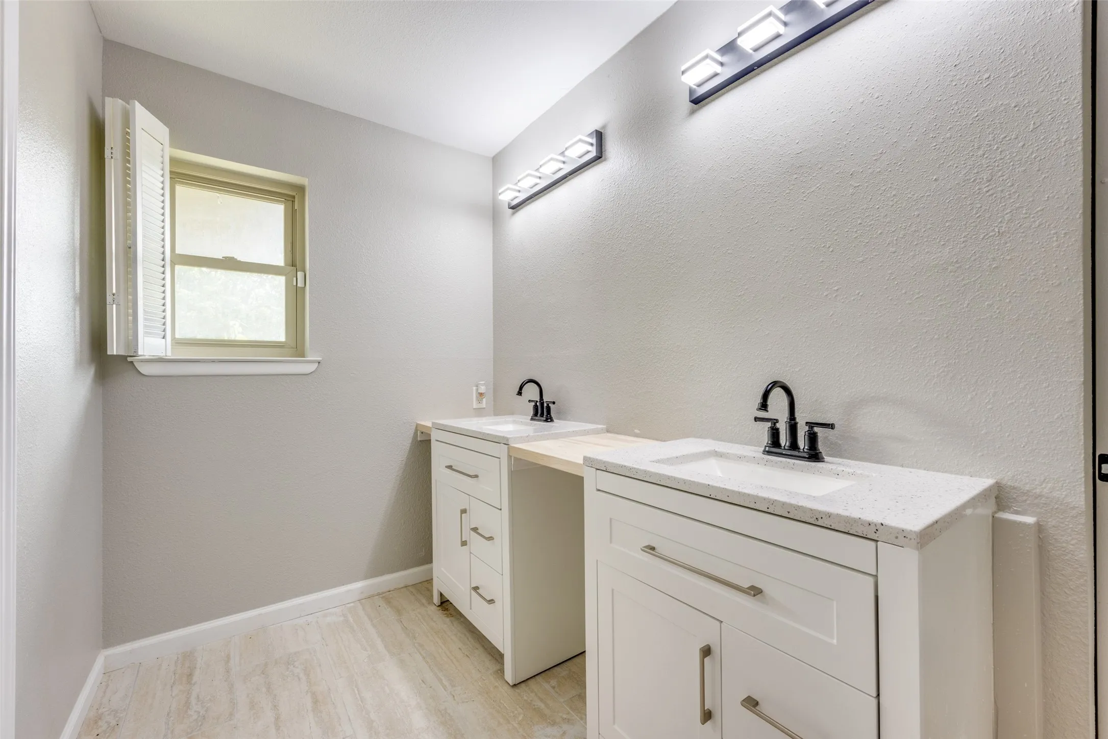 Full bathroom with vanity and wood finished floors