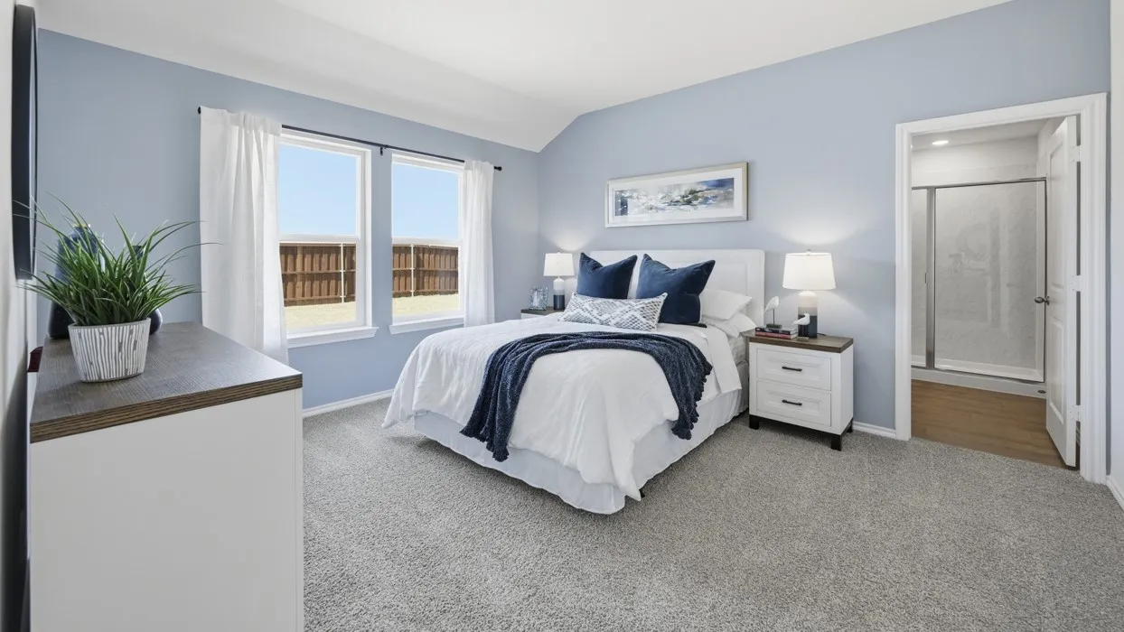 Carpeted room with light blue walls and a vaulted ceiling
