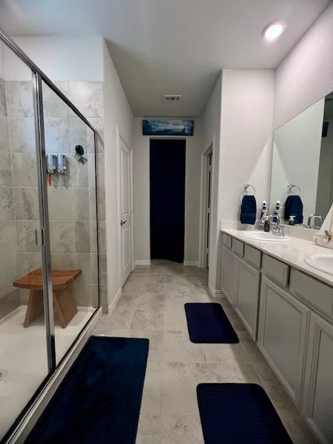 Large primary bath with his / hers , extra large shower and huge over-sized closet !