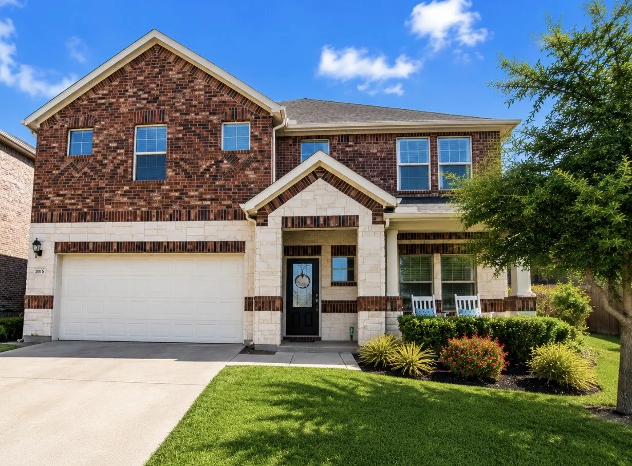 Beautiful brick and stone with covered front porch!