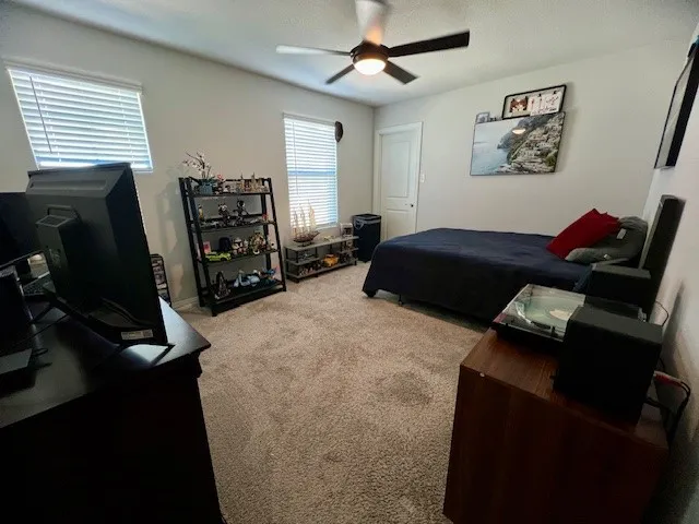 Secondary bedroom upstairs with walk in closet.