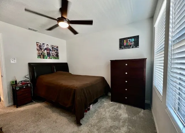Secondary bedroom upstairs with walk in closet.