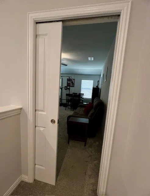 Upstairs second living or game room with a pocket door for privacy and noise control.