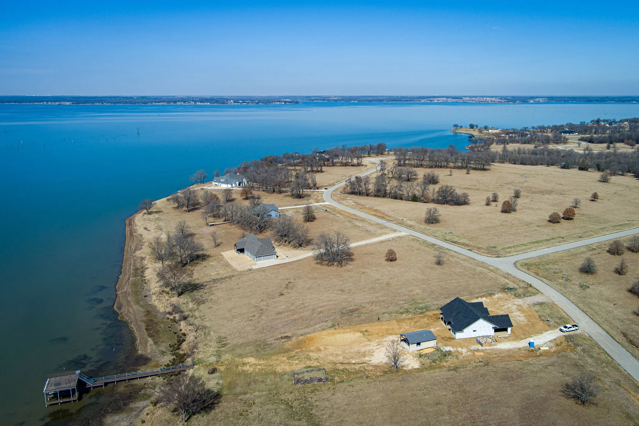 Aerial view of parcel with nearby lake.