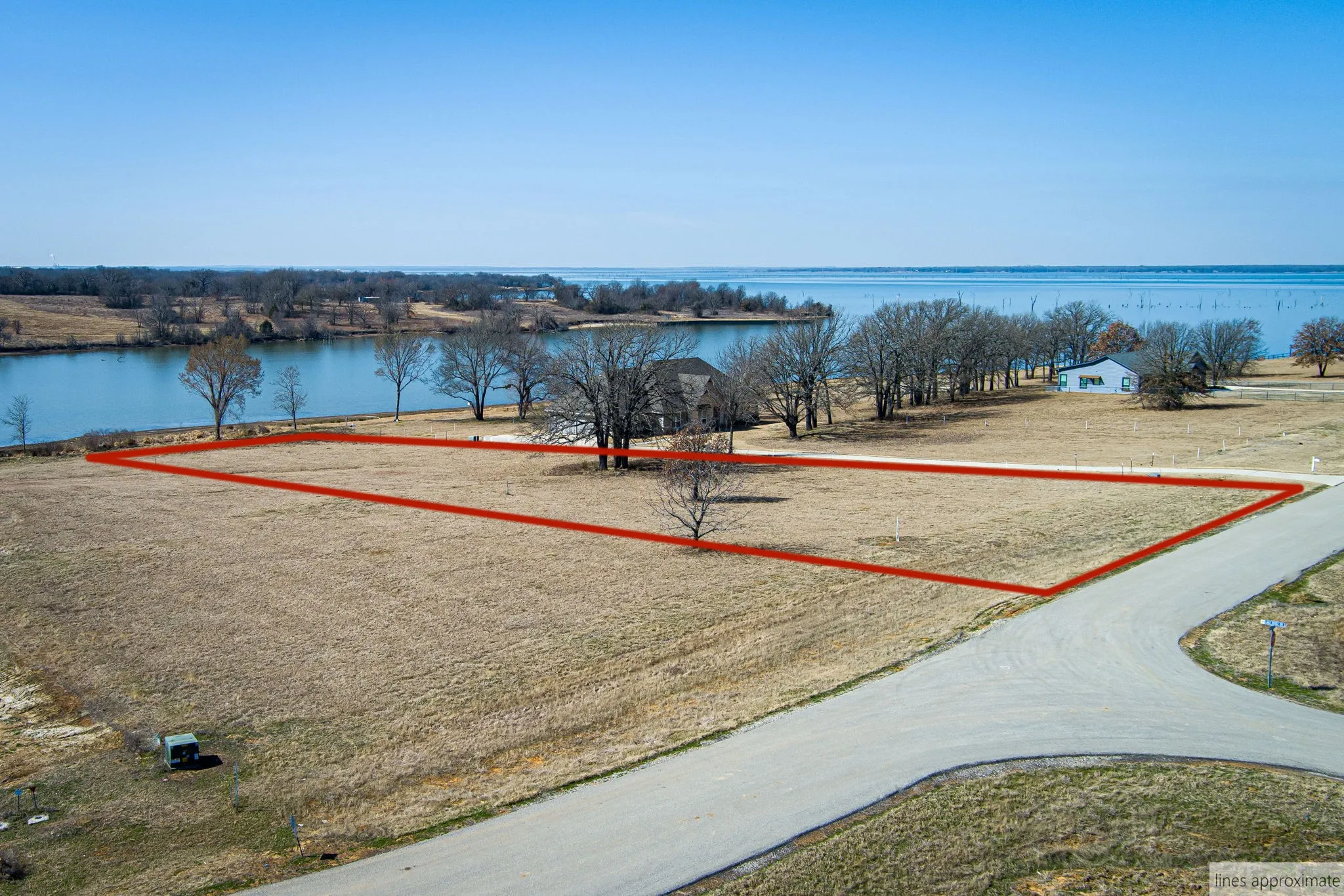 Drone / aerial view of property with lot lines.