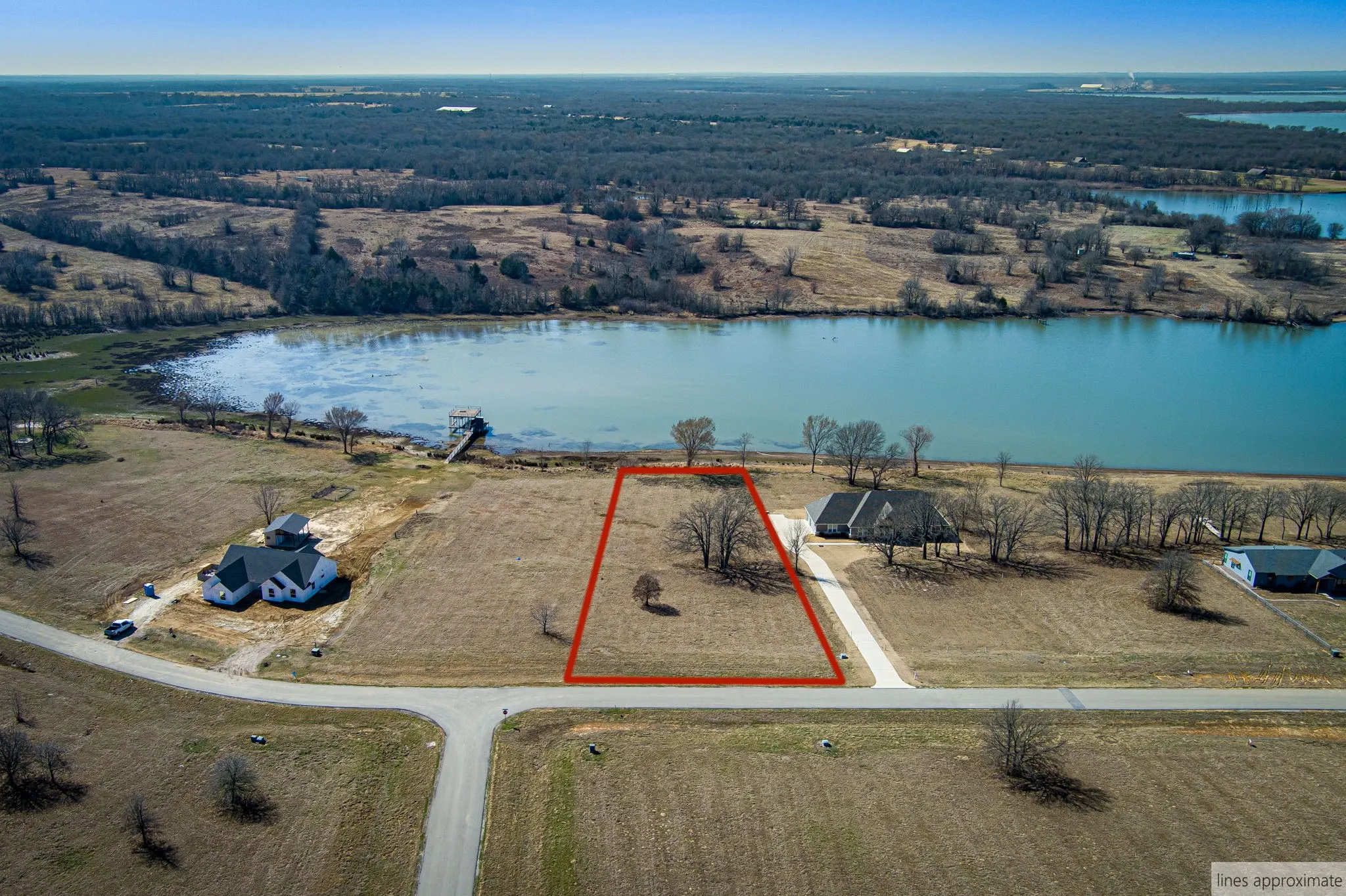 Drone / aerial view of property with lot lines.