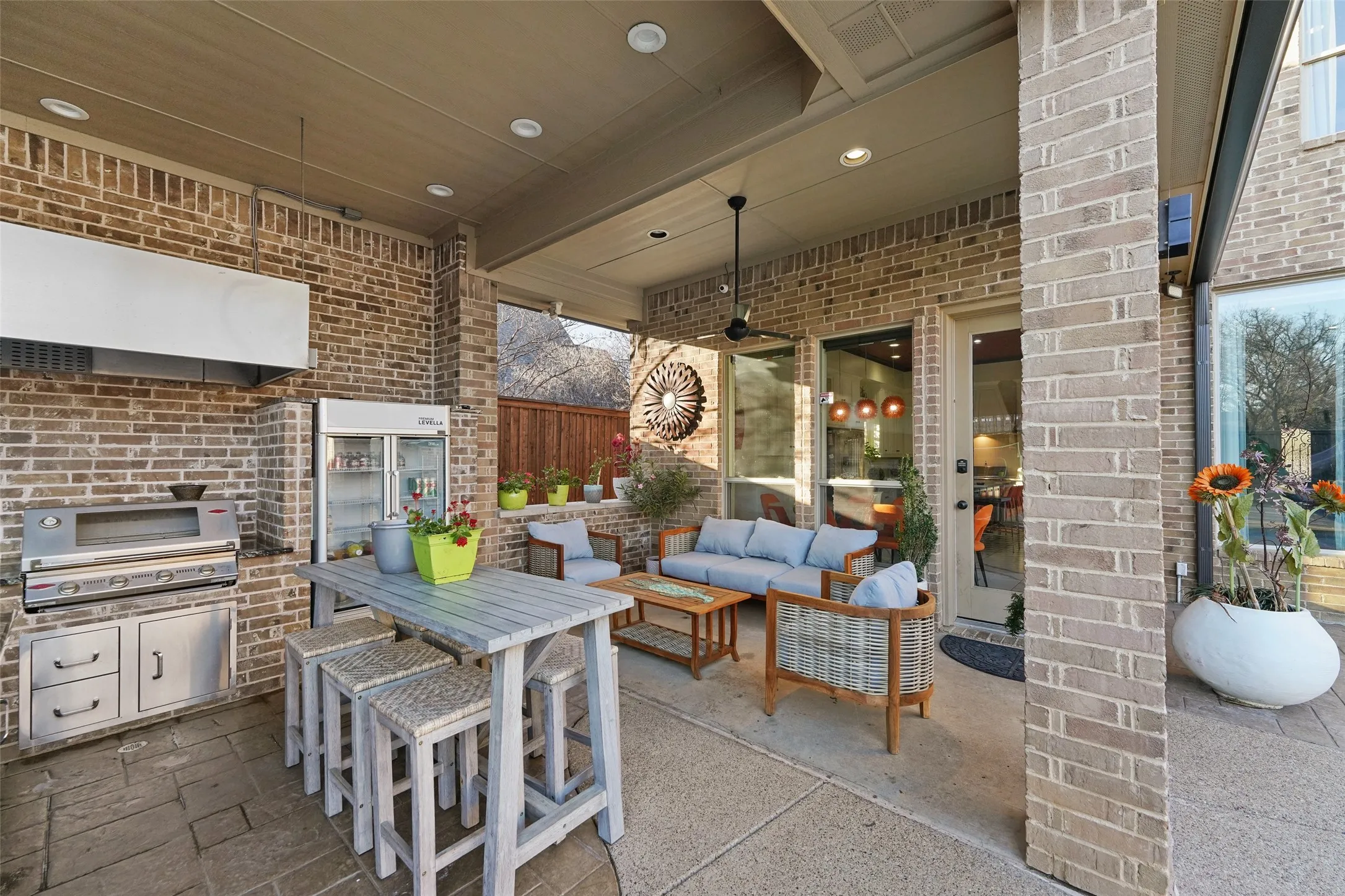 View of patio with outdoor lounge area and area for grilling