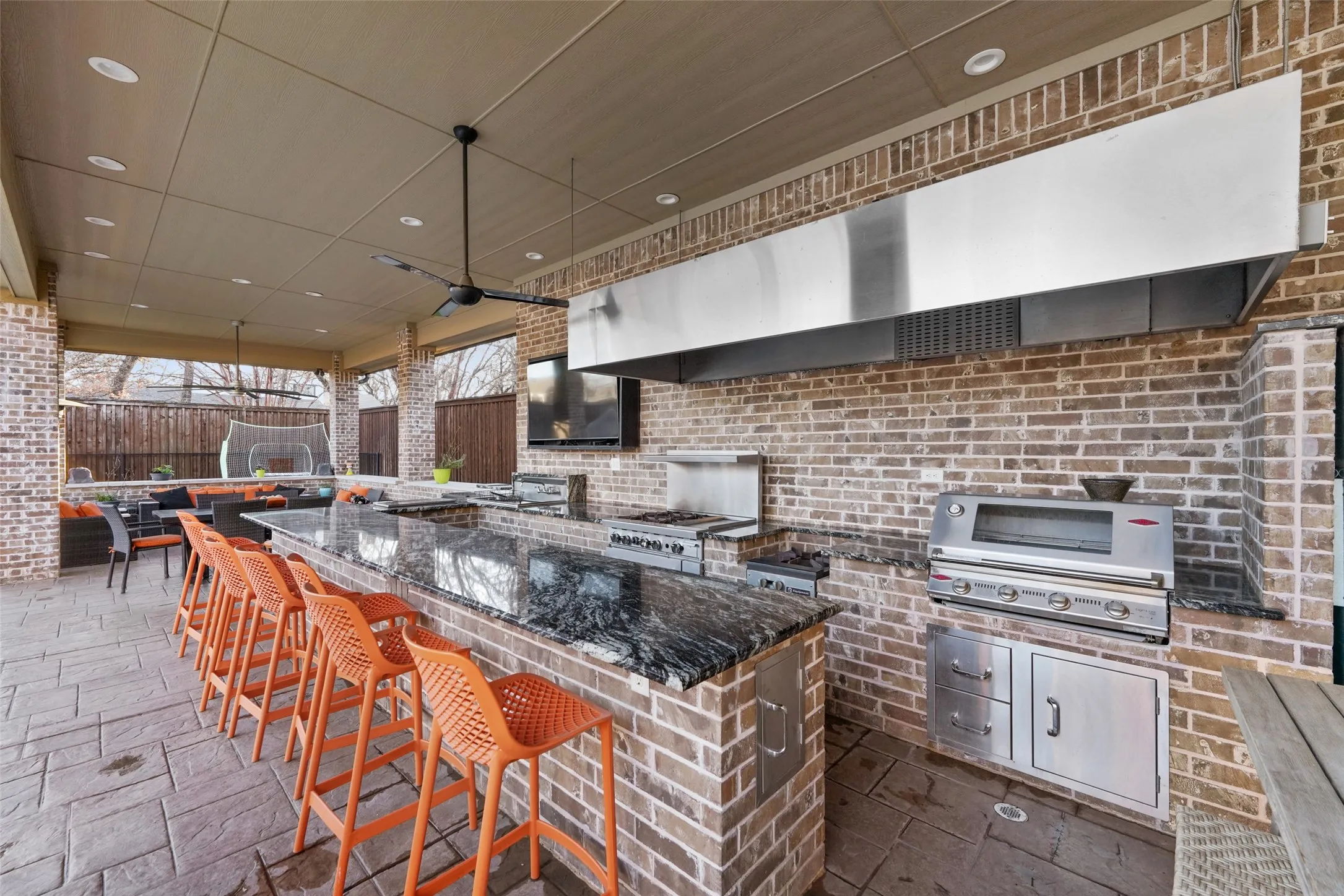View of patio with exterior kitchen