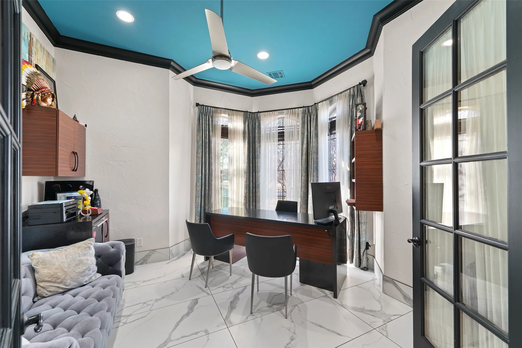 Office area with crown molding, a textured wall, a ceiling fan, recessed lighting, and light marble finish flooring