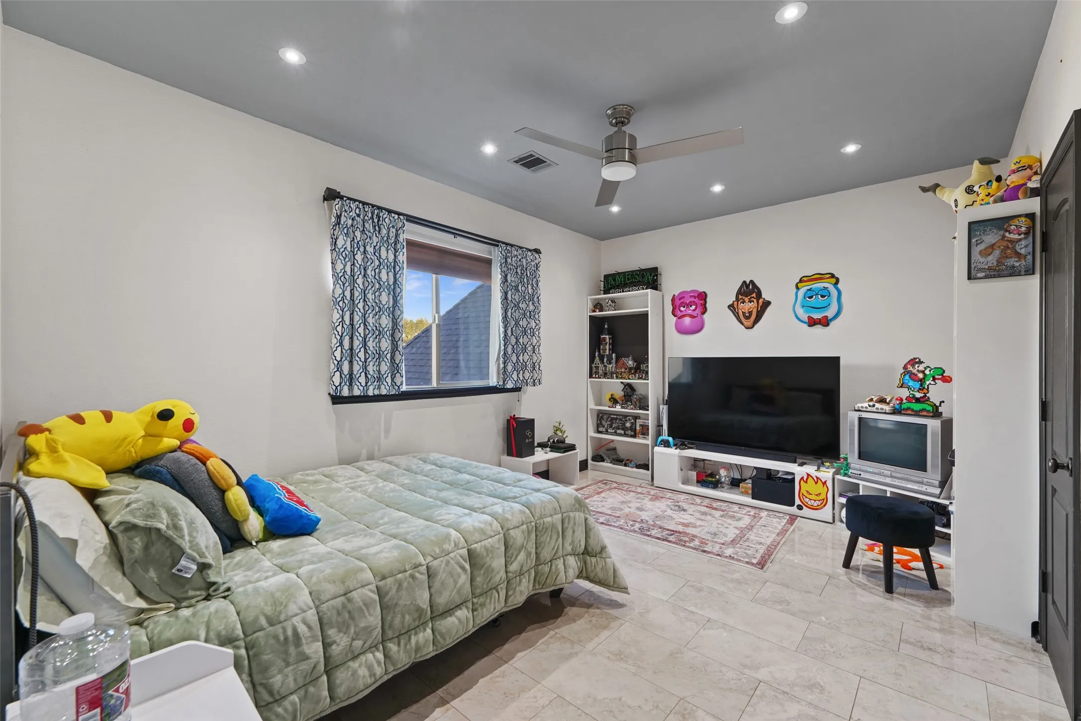Bedroom with ceiling fan and recessed lighting