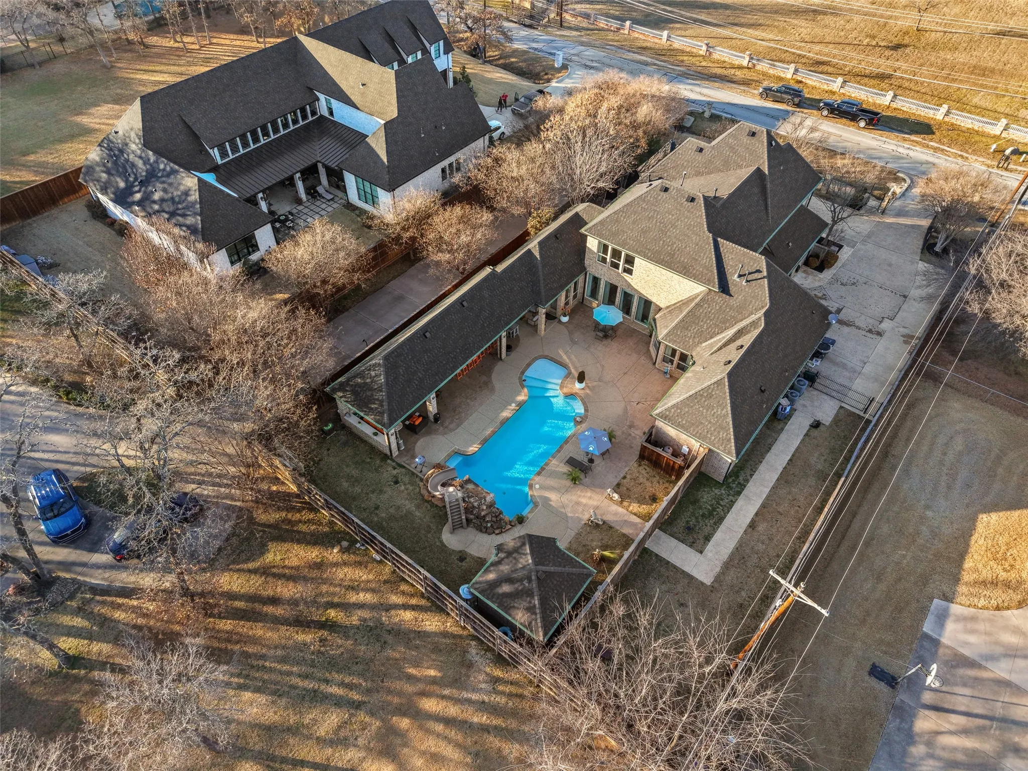 Aerial view of sparsely populated area with a pool area