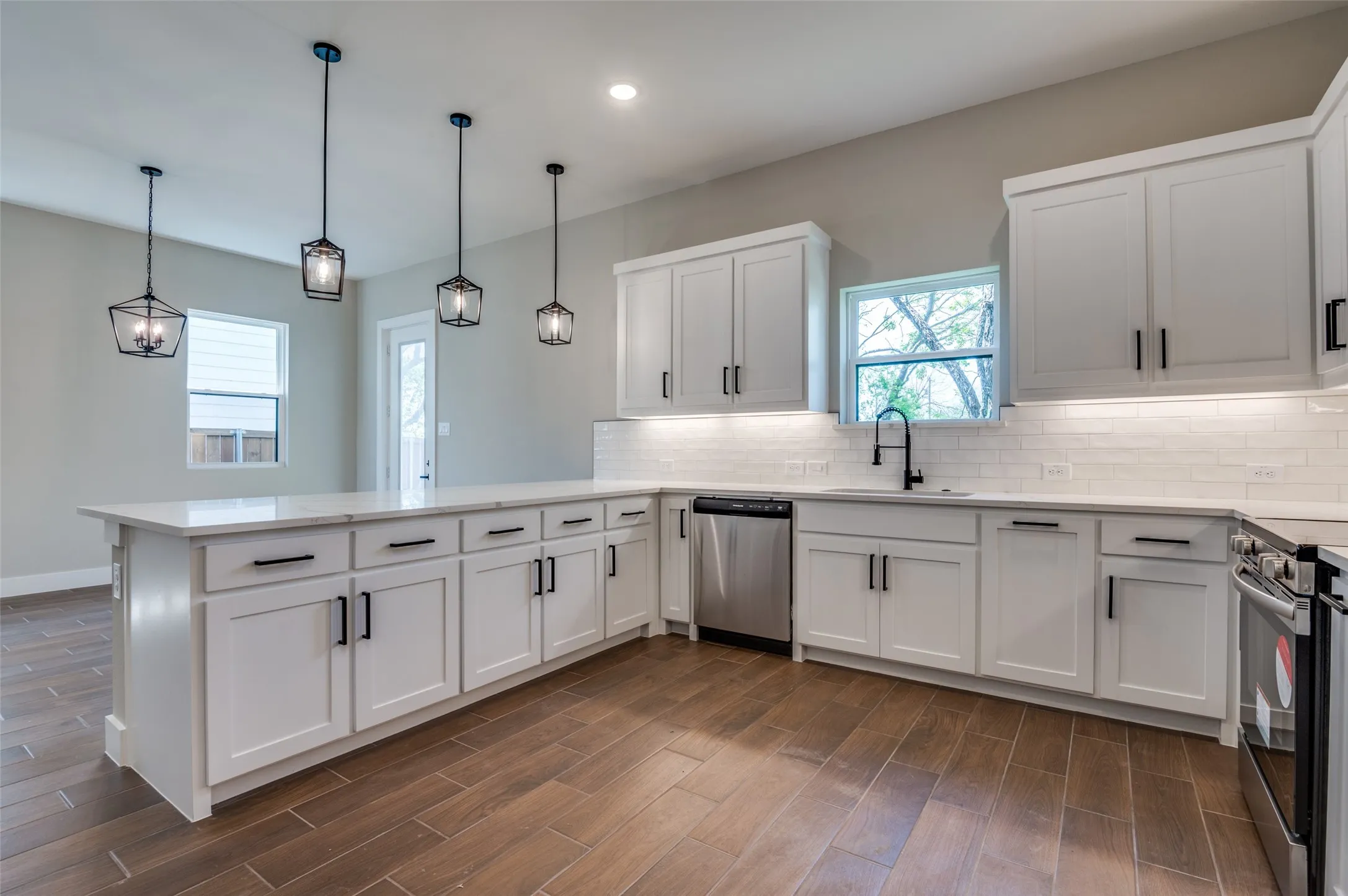 Custom Cabinets include recycling bin and cookie sheet drawer
