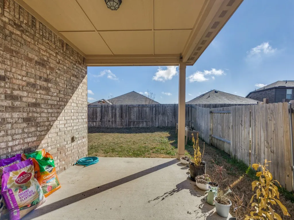 Fenced backyard featuring a patio area