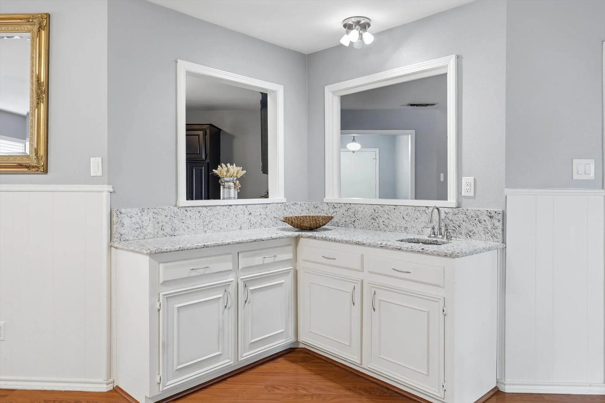 Stylish built-in wet bar featuring a sink and counter space, perfect for entertaining and serving drinks with ease.