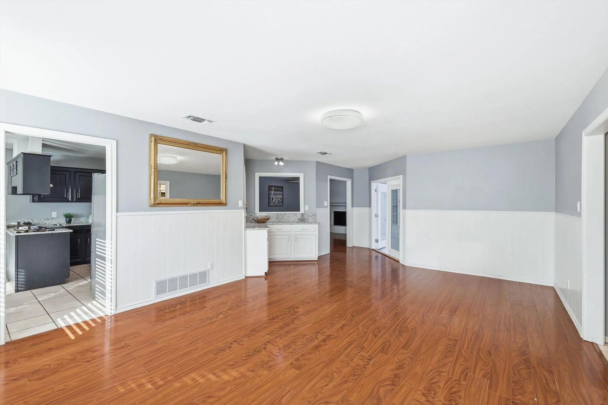 Inviting family room featuring a wet bar—perfect for entertaining.