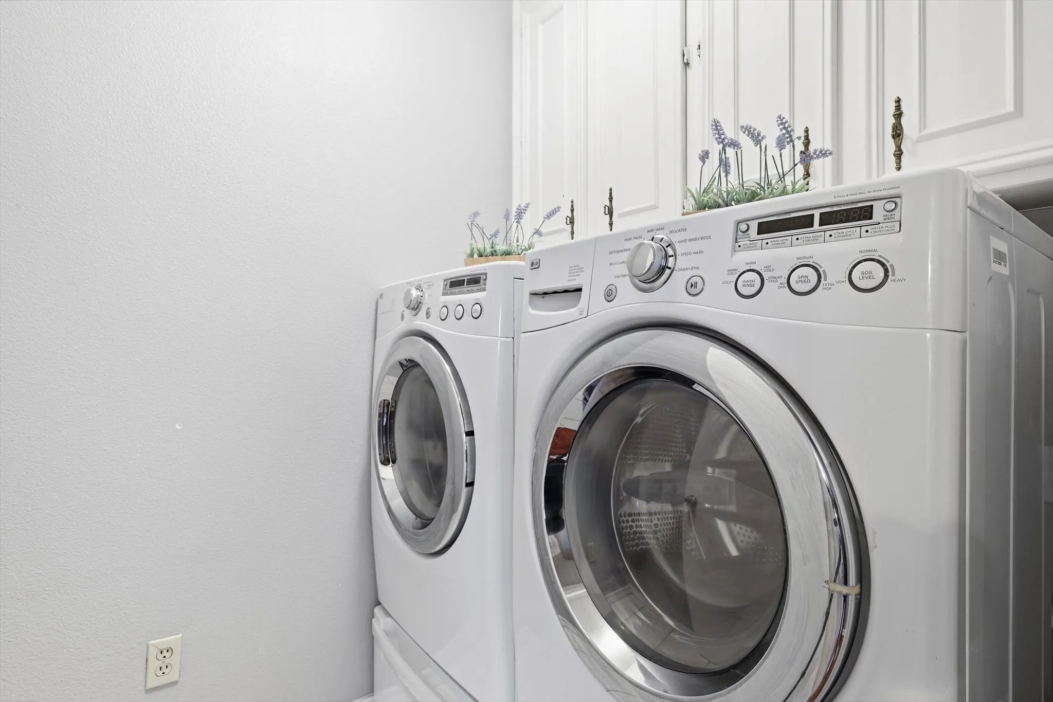 Functional laundry space with ample room for storage and organization.