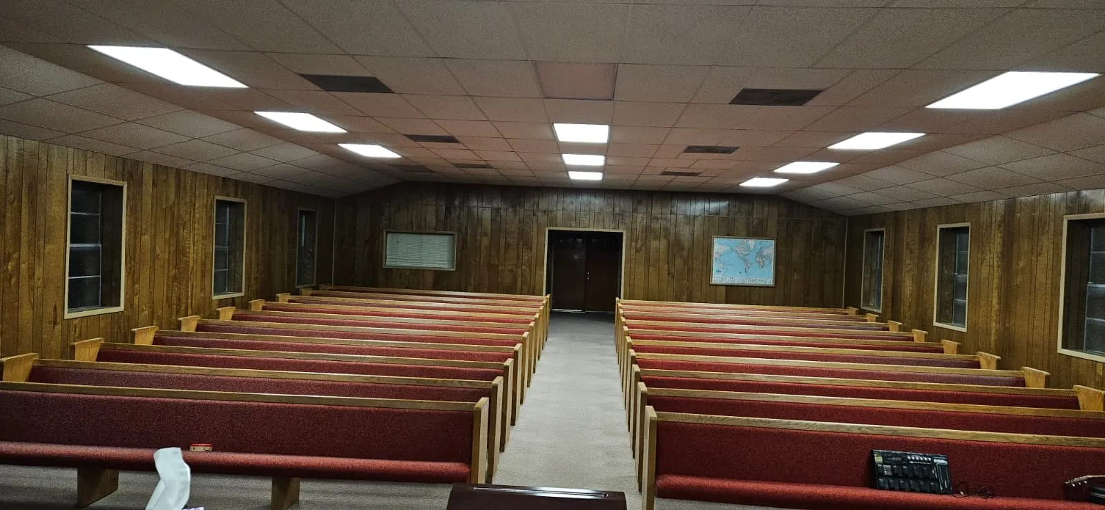 Sanctuary has a paneled ceiling and wood walls