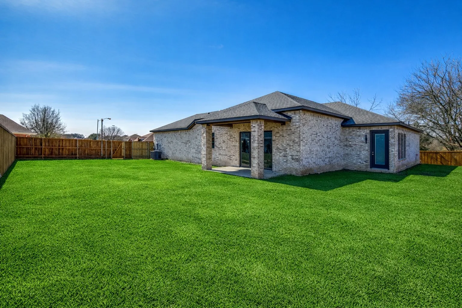 Virtually staged grass. Sod installed and still maturing.