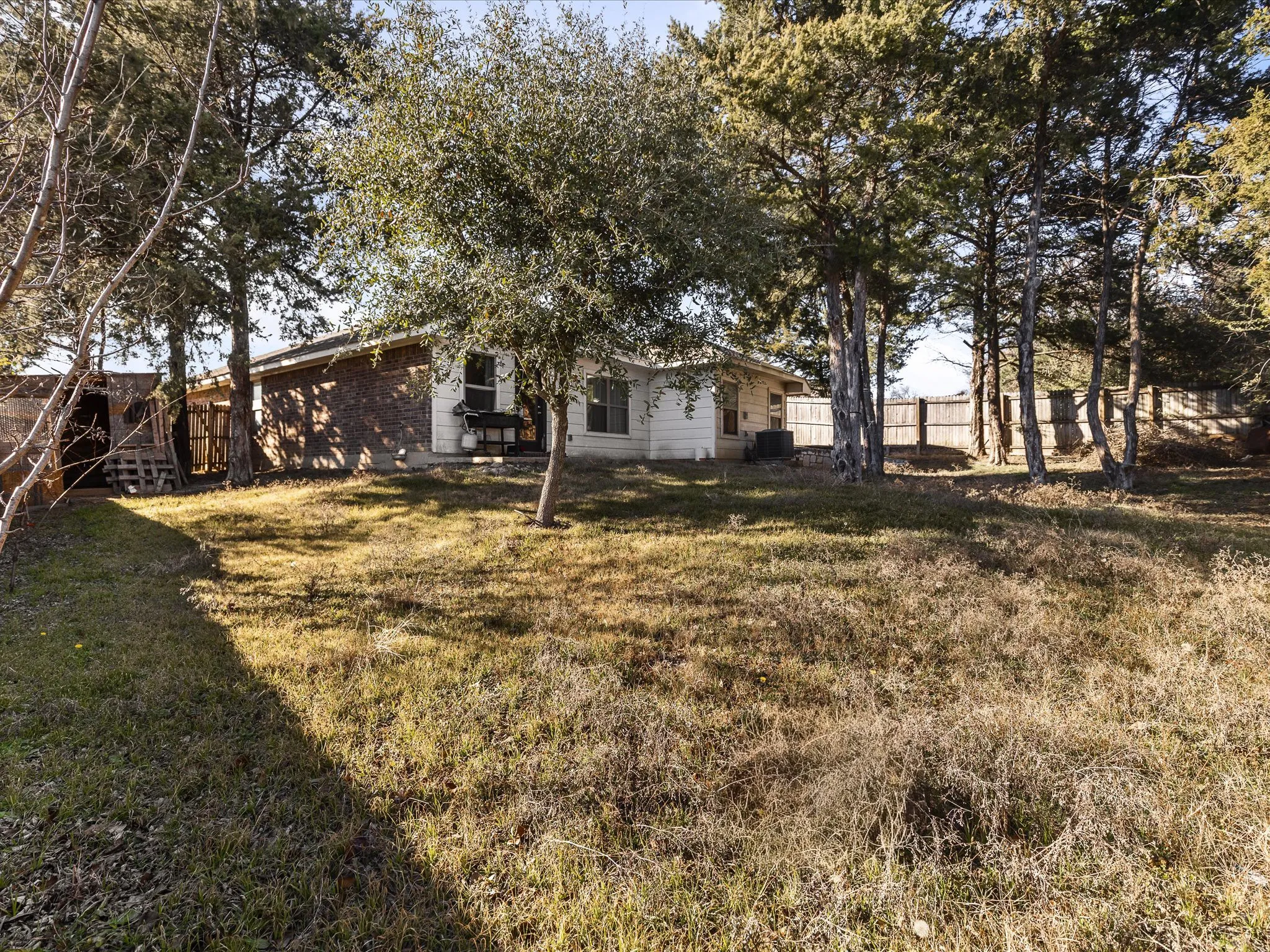 View of fenced backyard