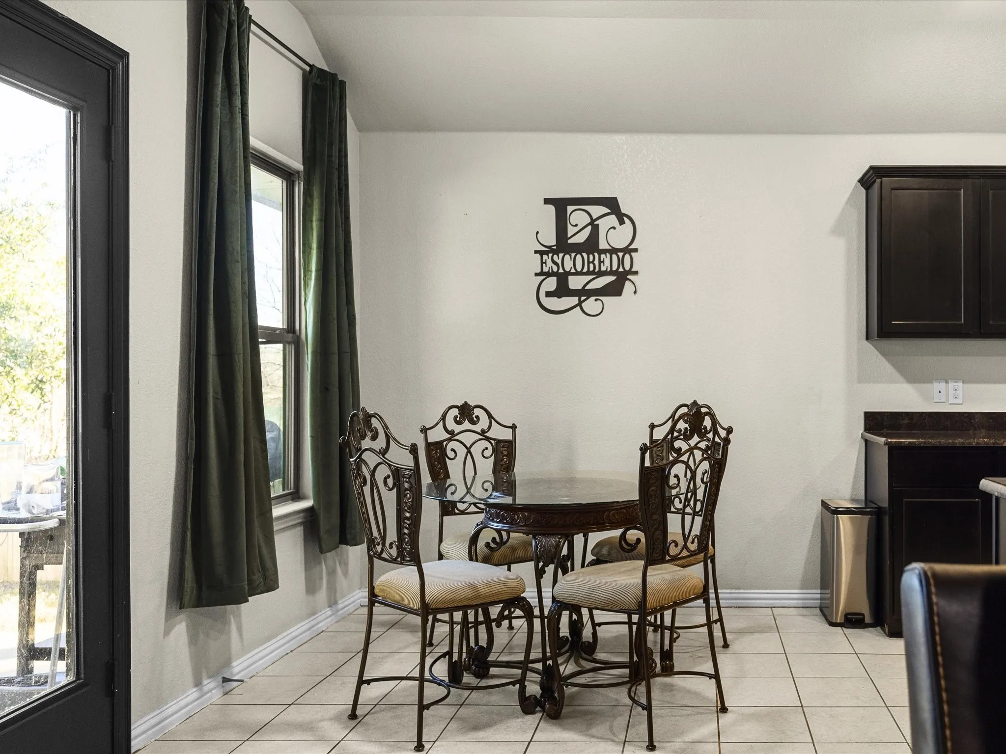 Dining area with light tile patterned flooring and lofted ceiling