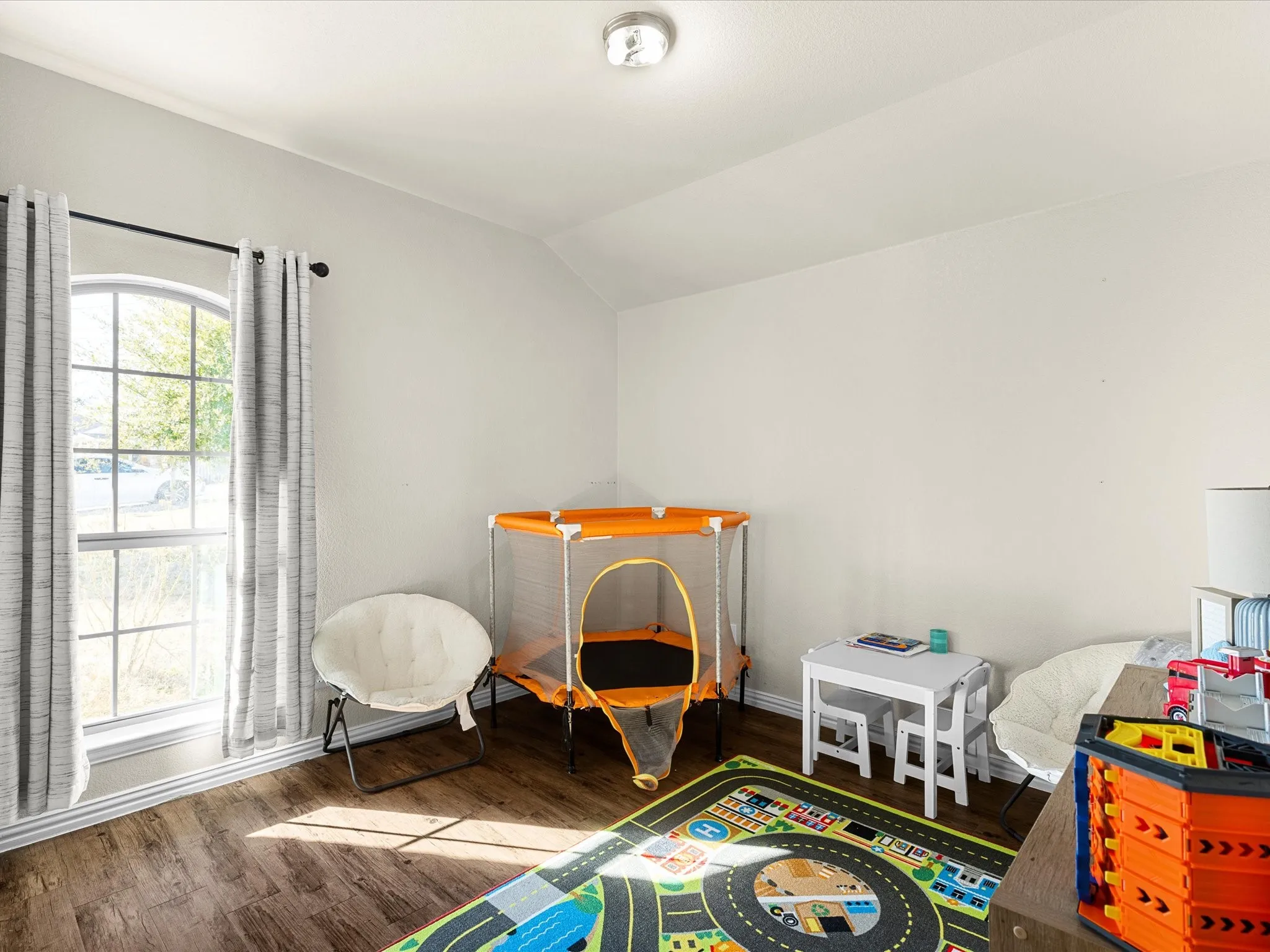 Rec room featuring lofted ceiling and wood finished floors