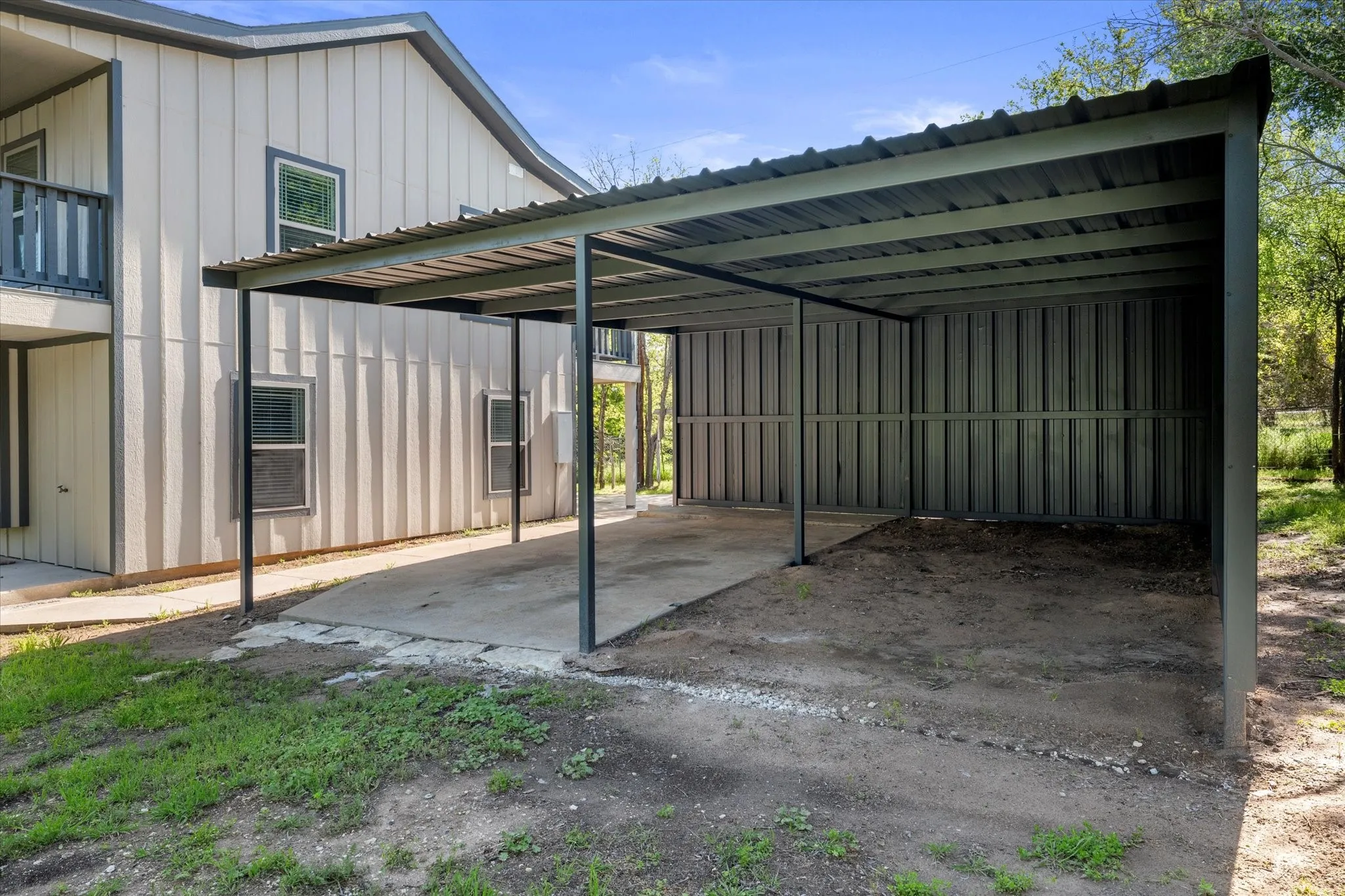 View of parking featuring a carport