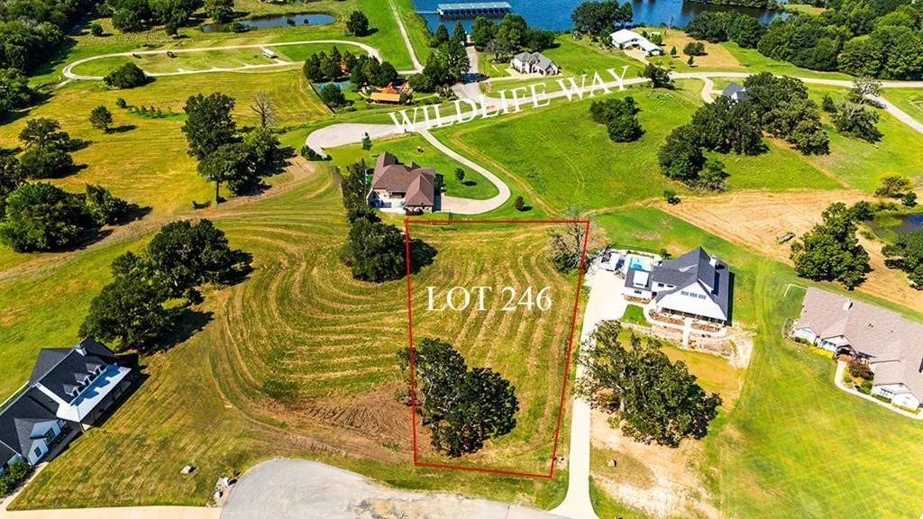 View of property location featuring a nearby body of water and property parcel outlined