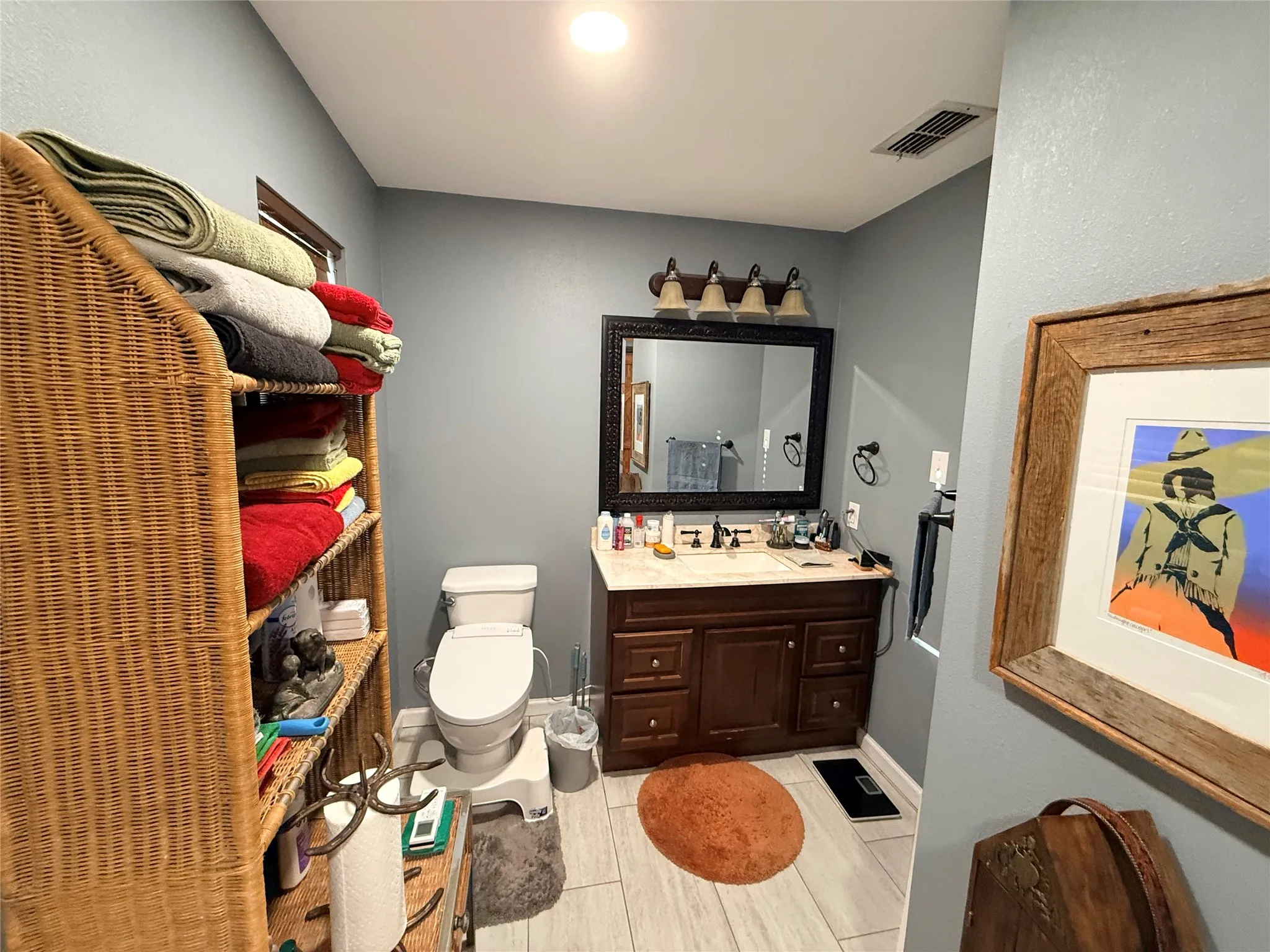 Bathroom featuring vanity and light tile patterned flooring