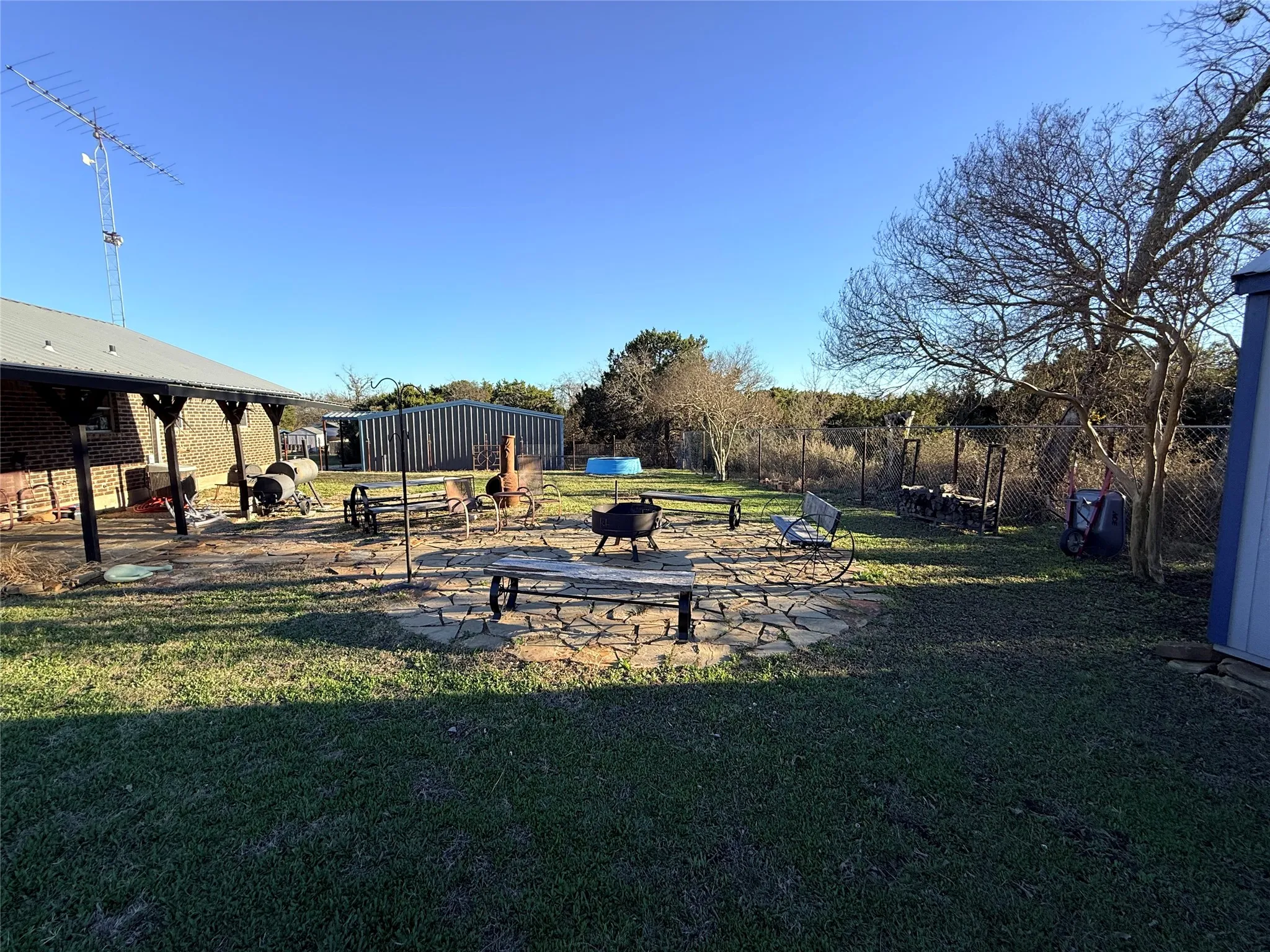 View of yard featuring a patio area and a fire pit