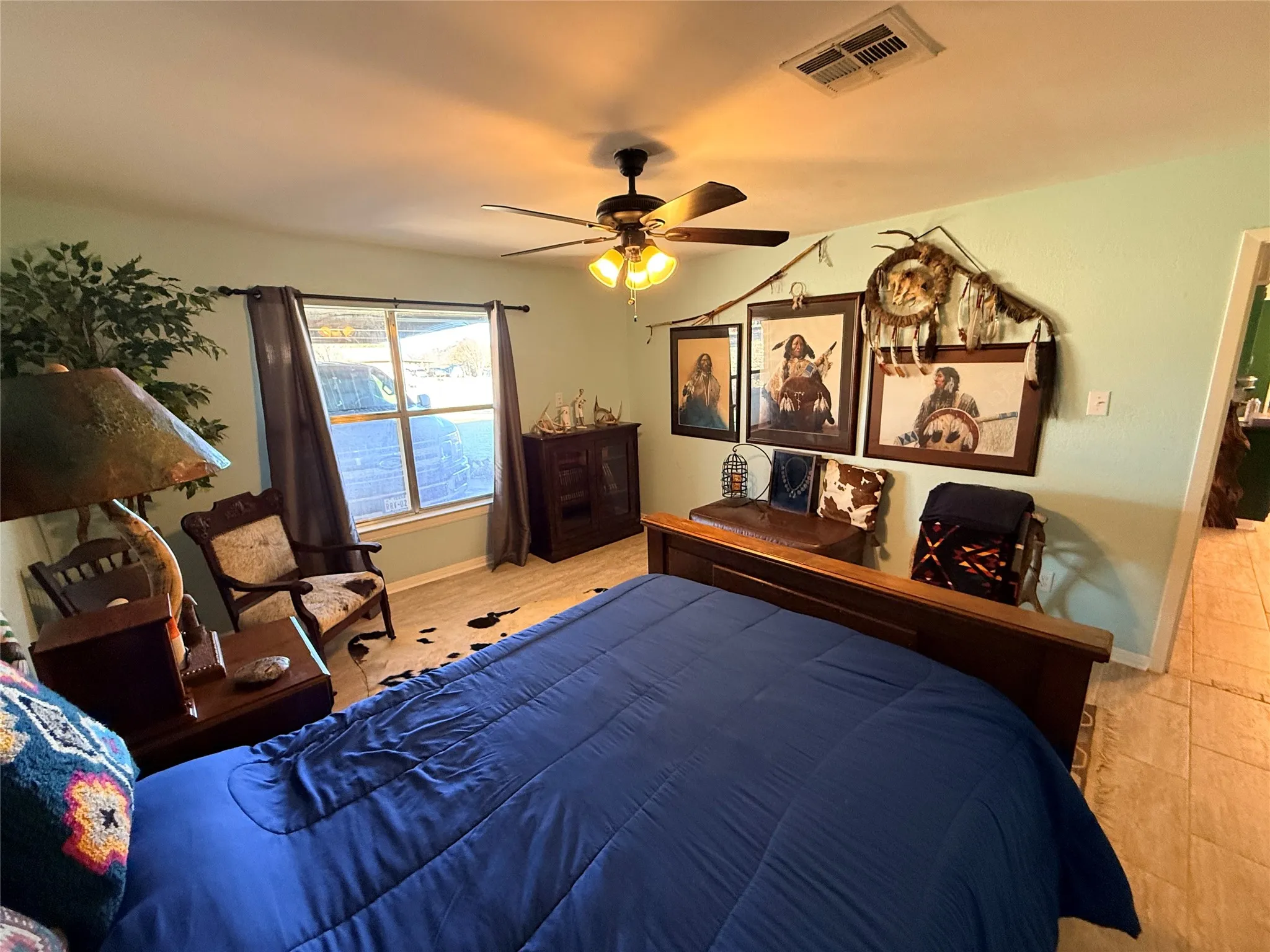 Bedroom featuring ceiling fan and baseboards