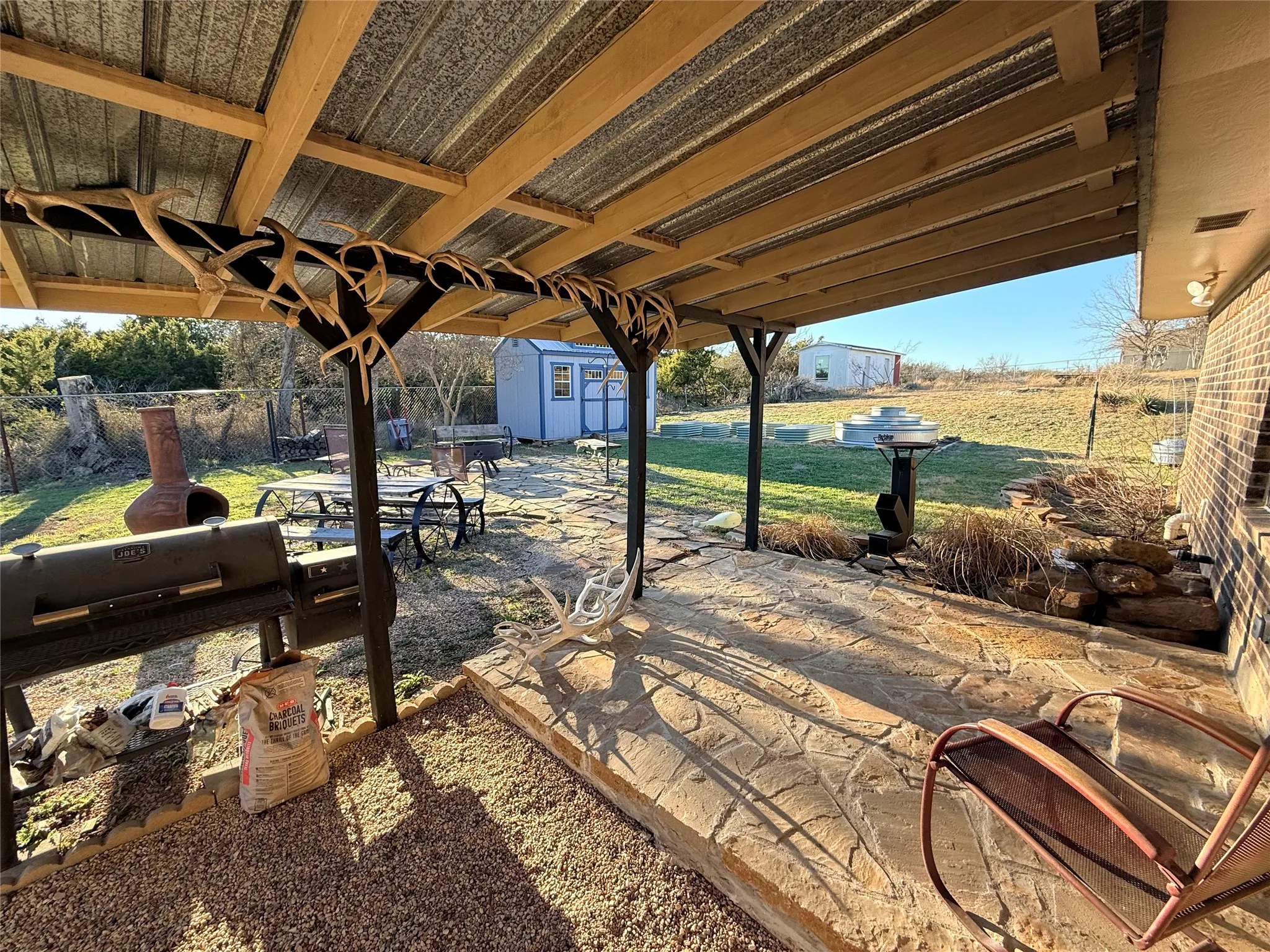 View of patio / terrace with a storage shed
