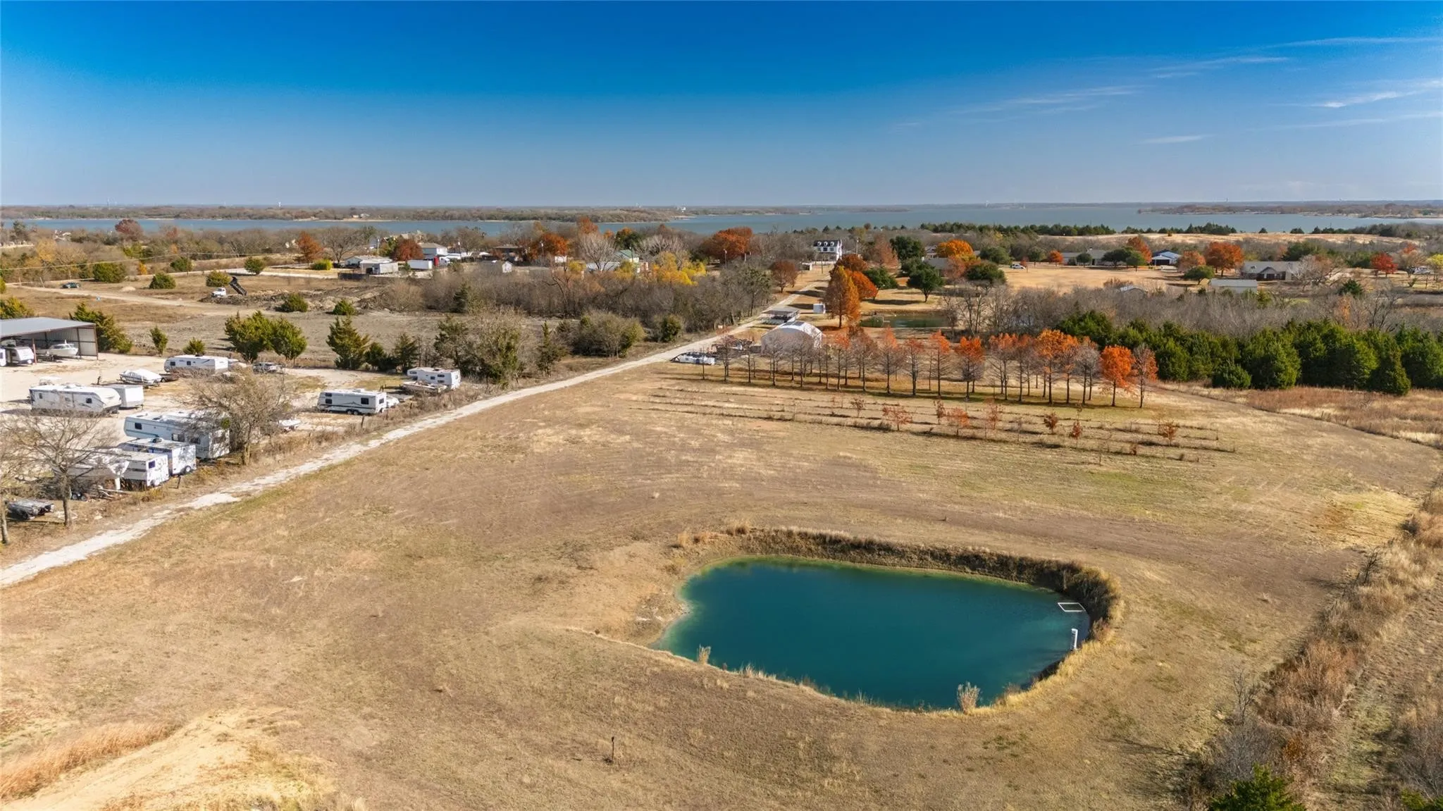 Pond, open areas, and some trees.