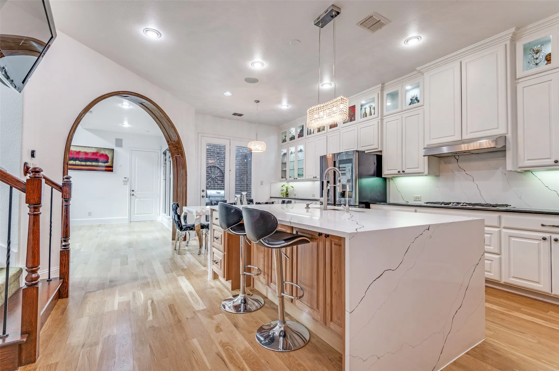 Kitchen with beautiful quartz counters and backsplash