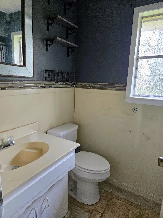 Bathroom featuring vanity and plenty of natural light